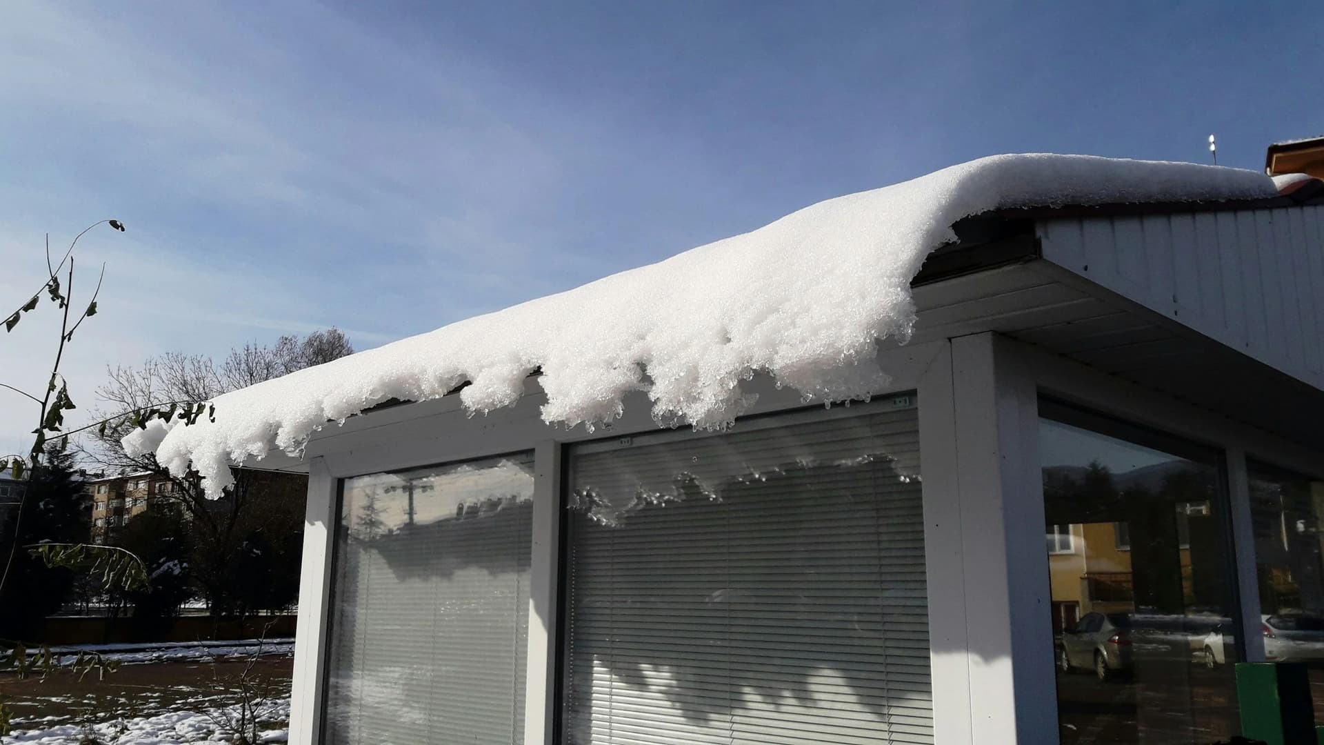 The Cost of Ice Dam Removal: What Homeowners Should Expect & Will Insurance Cover It? image